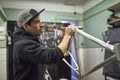 Latin man preparing a bicycle frame to paint in his workshop