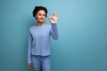 portrait latina brunette woman with wavy hair in blue stylish casual clothes Royalty Free Stock Photo