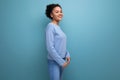 portrait latina brunette woman with wavy hair in blue stylish casual clothes Royalty Free Stock Photo