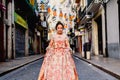Portrait of a latina fallera girl wearing the traditional valencian costume of Fallas Royalty Free Stock Photo