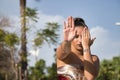 Portrait of Latina and Hispanic girl, young and beautiful, doing modern dance hand movements in the street outdoors. Dance concept Royalty Free Stock Photo