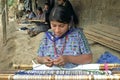 Portrait latino Indian woman weaving on hand loom Royalty Free Stock Photo