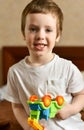 Portrait of a laughing baby boy with a toy in his hands Royalty Free Stock Photo