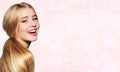 Portrait of laughing beautiful blonde young woman face.  Spa model girl with fresh clean skin and great teeth isolated on a blur Royalty Free Stock Photo