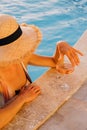 Portrait of laughing beautiful woman in swimwear relaxing in swimming spa pool