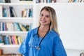 Portrait of laughing blond female nurse or doctor Royalty Free Stock Photo