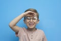 Portrait of a laughing little boy with glasses