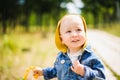 Portrait of a laughing little boy outdoors