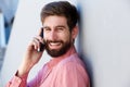 Laughing man having conversation on smart phone Royalty Free Stock Photo