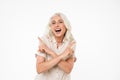 Portrait of a laughing mature woman pointing fingers Royalty Free Stock Photo