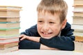 portrait of a laughing schoolboy close-up among a pile
