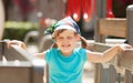 Portrait of laughing three-year girl at playground area