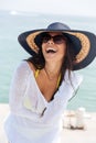 Portrait of a laughing woman wearing beach hat and bikini Royalty Free Stock Photo