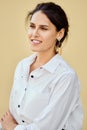 Portrait of legant lady in white shirt and wooden earrings