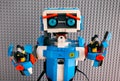 Portrait Lego BOOST robot against gray baseplate background