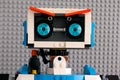 Portrait of Lego BOOST robot against gray baseplate background