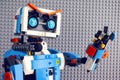 Portrait of Lego BOOST robot with gray baseplate background