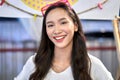 Portrait of a young asian woman smiling to the camera in a store