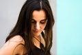 Portrait of a liberated young Arab woman with her long brown hair loose and free