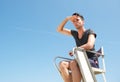 Portrait of a lifeguard sitting in chair on summer day Royalty Free Stock Photo