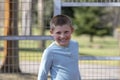 Portrait of a litte blond boy on playground