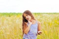 Portrait of a little adorable little girl smiling, in field with yellow flowers Royalty Free Stock Photo