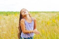 Portrait of a little adorable little girl smiling, in field with yellow flowers Royalty Free Stock Photo