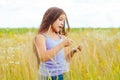 Portrait of a little adorable little girl smiling, in field with yellow flowers Royalty Free Stock Photo