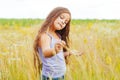 Portrait of a little adorable little girl smiling, in field with yellow flowers Royalty Free Stock Photo