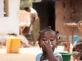Portrait of a little African girl drinking