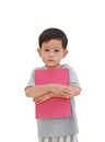 Portrait of little Asian baby boy age about 3 years old hugging a book on white isolated background with clipping path. Education Royalty Free Stock Photo