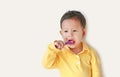 Portrait of little Asian baby boy brushing teeth on white background Royalty Free Stock Photo