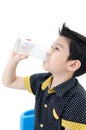 Portrait of Little asian boy drinking a glass of milk Royalty Free Stock Photo