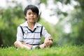 Portrait of a little asian boy in the park Royalty Free Stock Photo