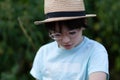 Portrait of a little boy wearing glasses and a straw hat Royalty Free Stock Photo