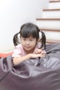 Portrait of little Asian child girl looks sad or in a suspicious mood Royalty Free Stock Photo