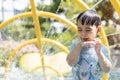 Portrait of little Asian cute boy enjoying day trip to an aqua amusement park during summer family vacation Royalty Free Stock Photo