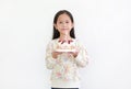 Portrait little asian kid girl holding happy birthday cake isolated on white background Royalty Free Stock Photo