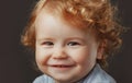 Portrait of little baby. Concept of kids face close-up. Head shoot children portrait. Smiling infant, cute smile.