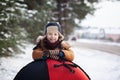 Portrait little baby with tube in winter day. Cute boy play outdoors in snow Royalty Free Stock Photo