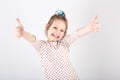 Portrait of little beautiful and confident girl showing thumbs Royalty Free Stock Photo