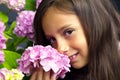 Portrait of a little beautiful girl with a bouquet of hydrangeas in her hands. Royalty Free Stock Photo