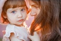 Portrait of a little beautiful girl in the rays of the sunset. Royalty Free Stock Photo