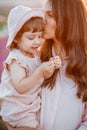 Portrait of a little beautiful girl in the rays of the sunset. Royalty Free Stock Photo