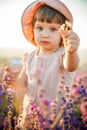 Portrait of a little beautiful girl in the rays of the sunset. Royalty Free Stock Photo
