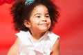 Portrait of little black curly haired girl