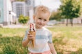 Portrait of a little boy. A baby eats a delicious ice cream cone. Happy child Royalty Free Stock Photo