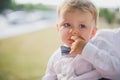 Portrait of  little boy, child holds  finger in his mouth Royalty Free Stock Photo