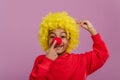 Portrait of little boy in clown costume.