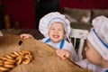 Portrait of a little boy cook at kitchen. Different occupations. Isolated over white background Royalty Free Stock Photo